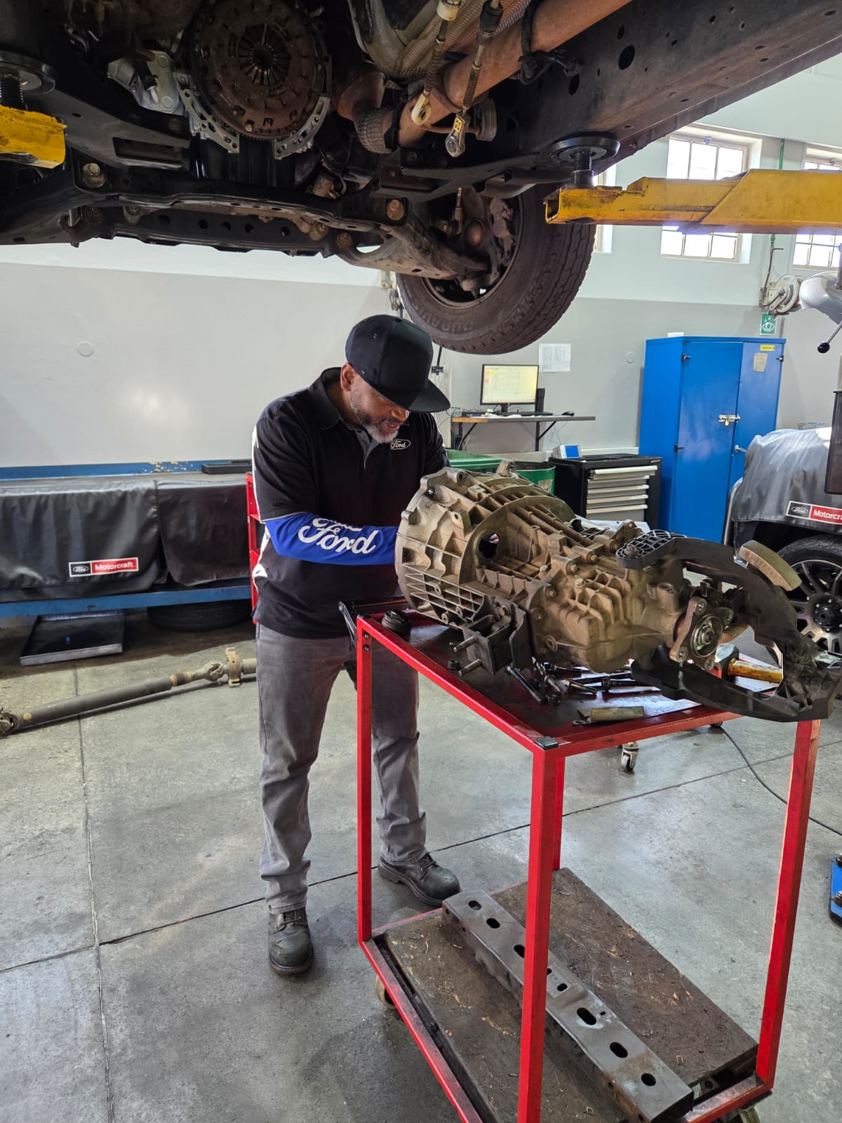 Elevate Auto's Ford Master Technician carrying out hands-on mechanical work